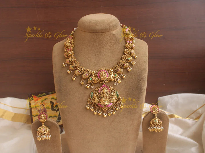 Exquisite Lotus and peacock carved jadau short necklace with pink and green stones and gold beads - Sparkle and Glow