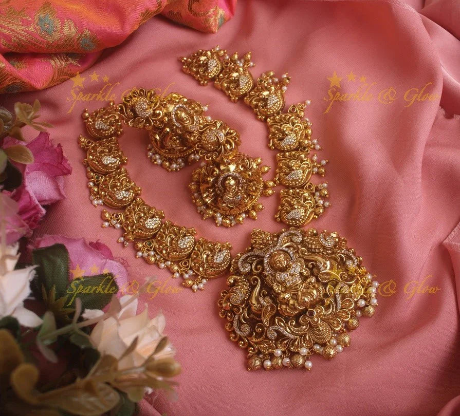 Exquisite gold alike Lakshmi and peacock carved short necklace with pearls and gold beads - Sparkle and Glow