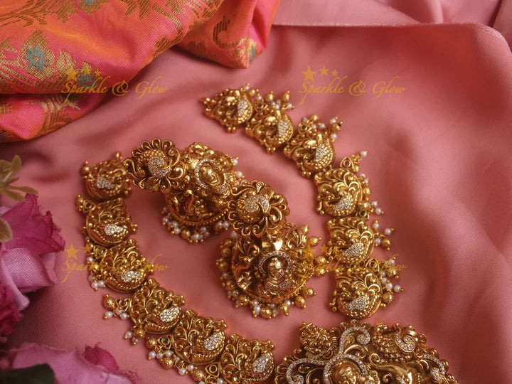 Exquisite gold alike Lakshmi and peacock carved short necklace with pearls and gold beads - Sparkle and Glow