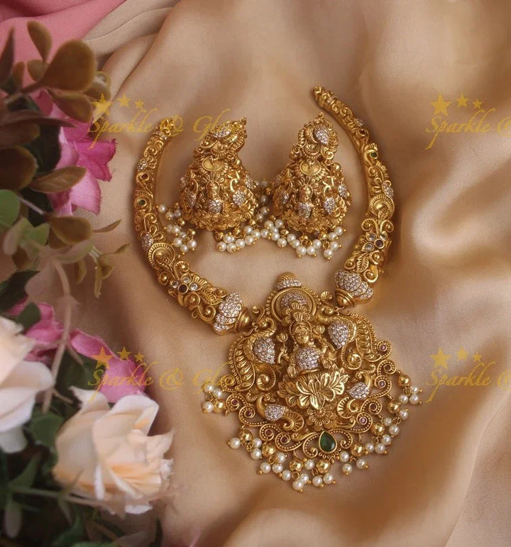 Beautiful Gold alike Lakshmi and peacock carved short necklace with pearls and gold beads - Sparkle and Glow