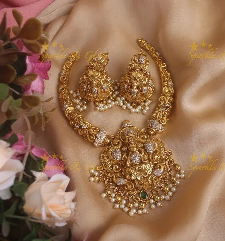 Beautiful Gold alike Lakshmi and peacock carved short necklace with pearls and gold beads - Sparkle and Glow