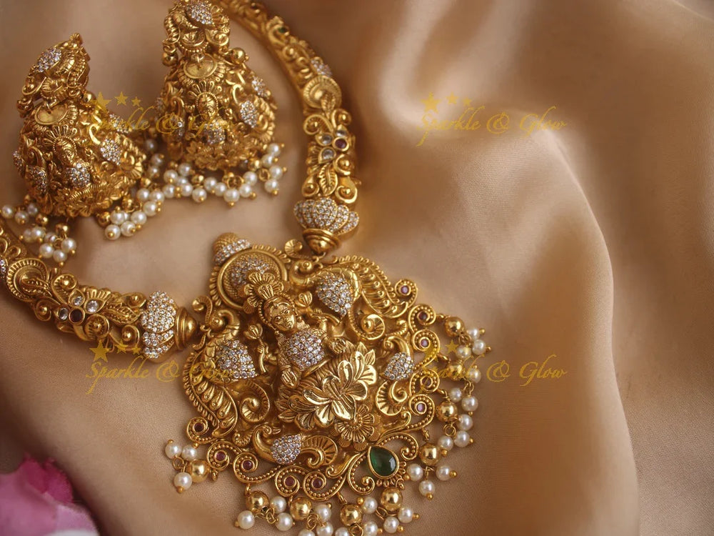 Beautiful Gold alike Lakshmi and peacock carved short necklace with pearls and gold beads - Sparkle and Glow