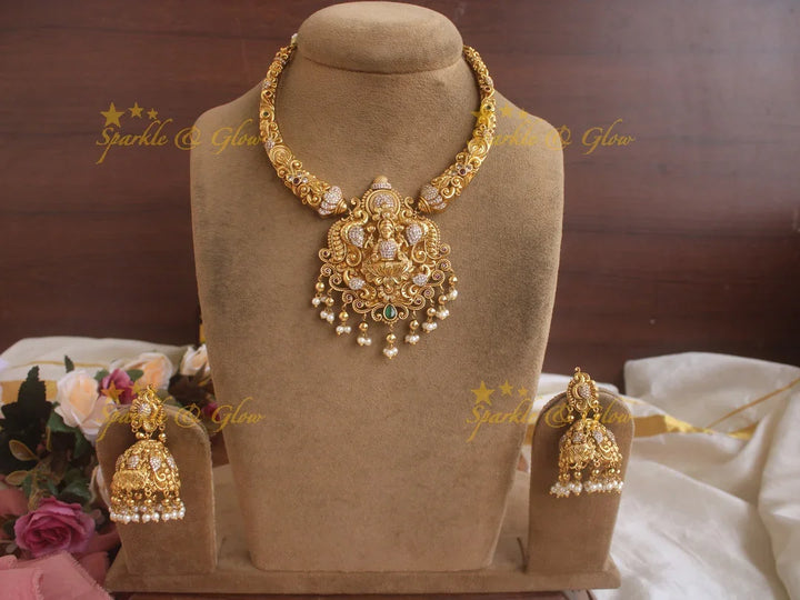 Beautiful Gold alike Lakshmi and peacock carved short necklace with pearls and gold beads - Sparkle and Glow