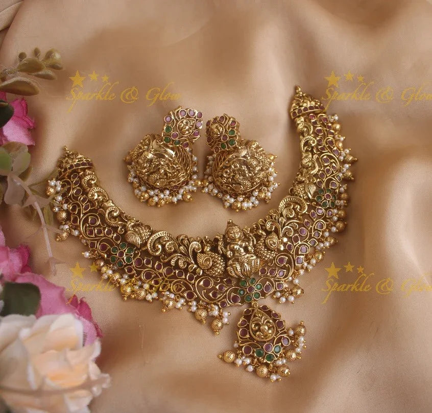 Elegant Lakshmi and peacock jadau short necklace with ruby emerald and pearls and gold beads - Sparkle and Glow