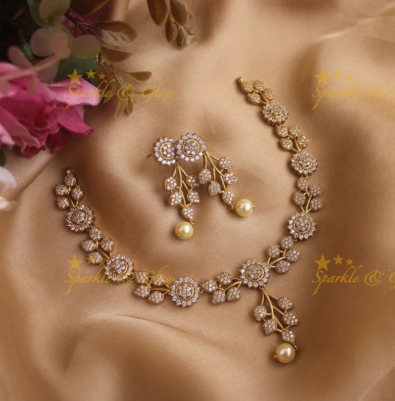 Statement Ad necklace with flower and leaf design with pearls - Sparkle and Glow