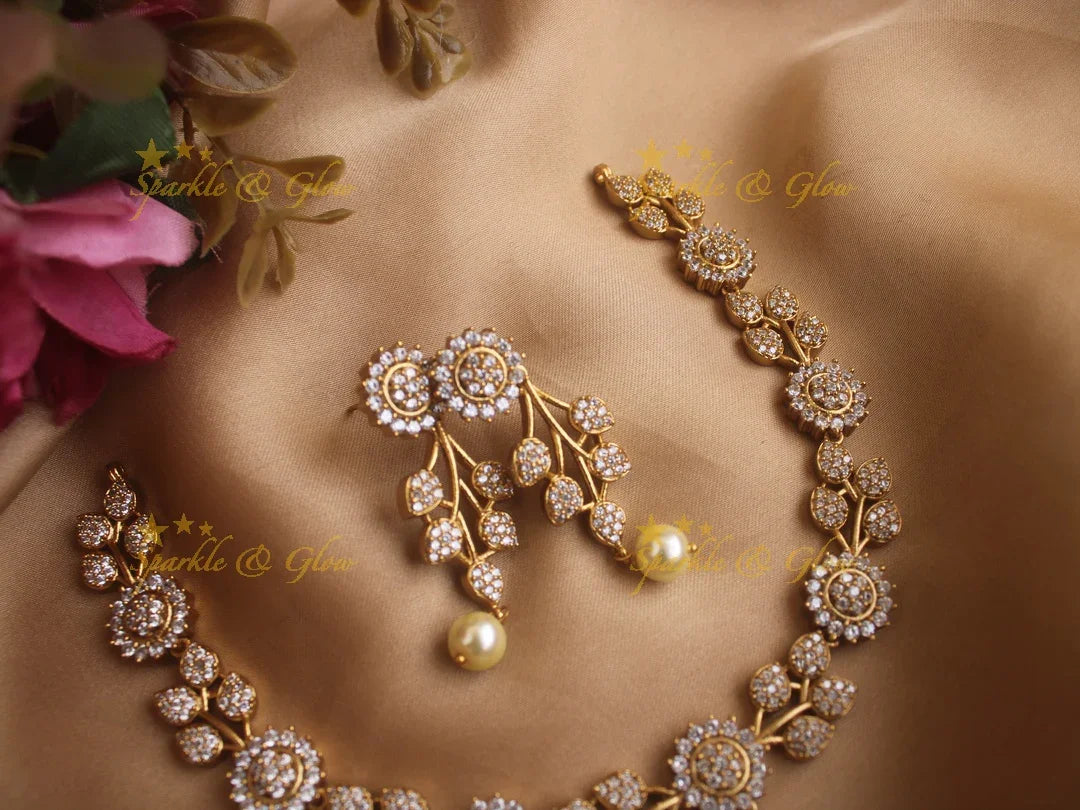 Statement Ad necklace with flower and leaf design with pearls - Sparkle and Glow