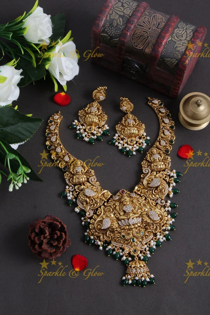 Grand Gold alike Lakshmi carved bridal necklace with emerald and gold beads - Sparkle and Glow