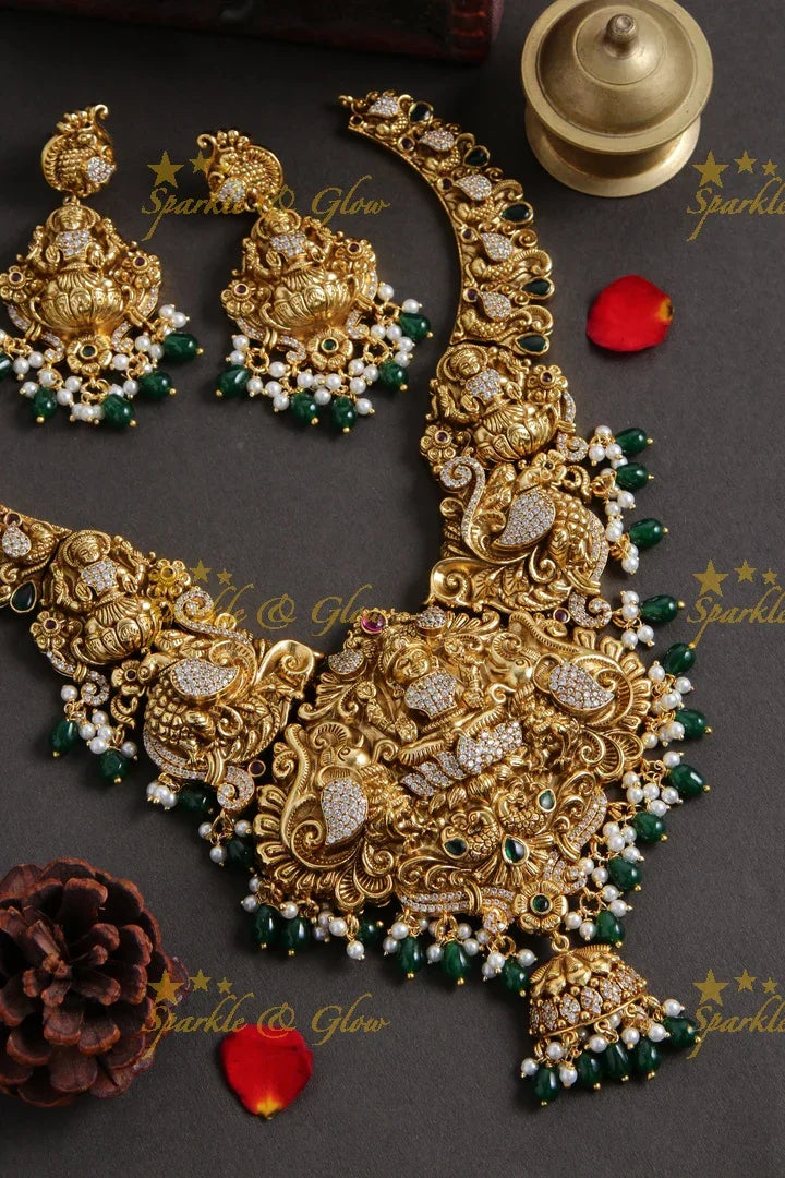 Grand Gold alike Lakshmi carved bridal necklace with emerald and gold beads - Sparkle and Glow