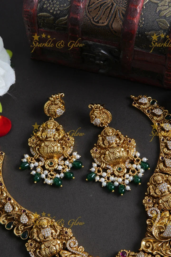 Grand Gold alike Lakshmi carved bridal necklace with emerald and gold beads - Sparkle and Glow