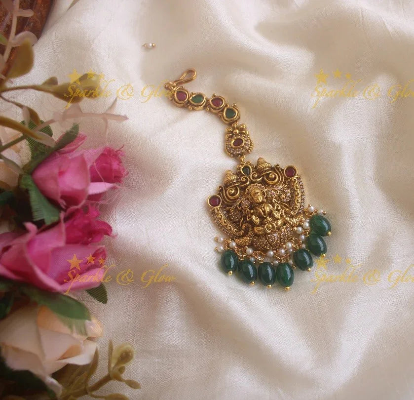 Gold alike Lakshmi peacock maang tikka with cz stones and green beads - Sparkle and Glow