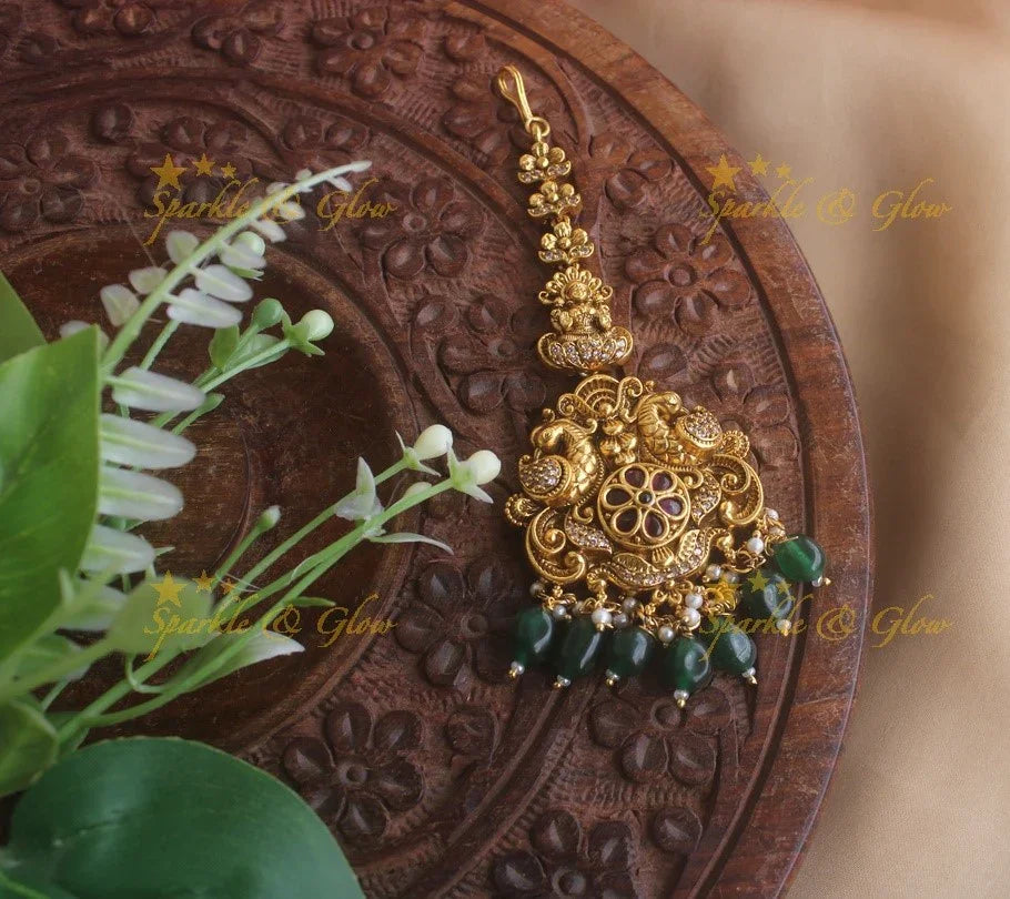Gold alike Lakshmi peacock maang tikka with cz stones ruby and gold beads - Sparkle and Glow