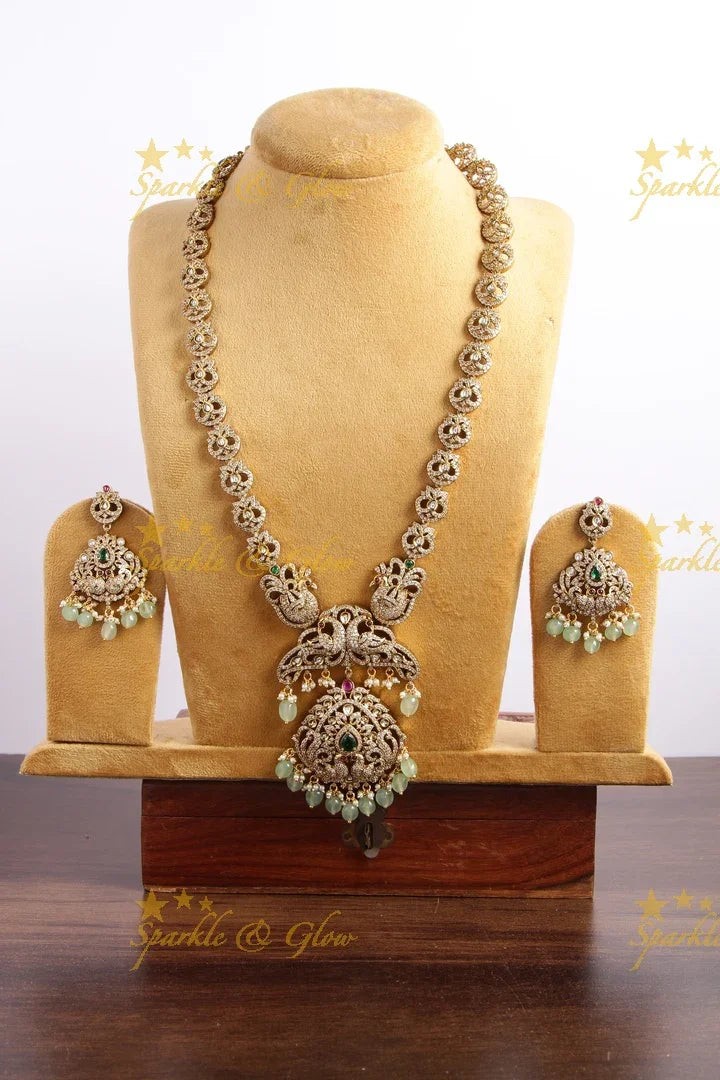 Exclusive Peacock design Victorian AD long necklace with pearls and mint green beads - Sparkle and Glow