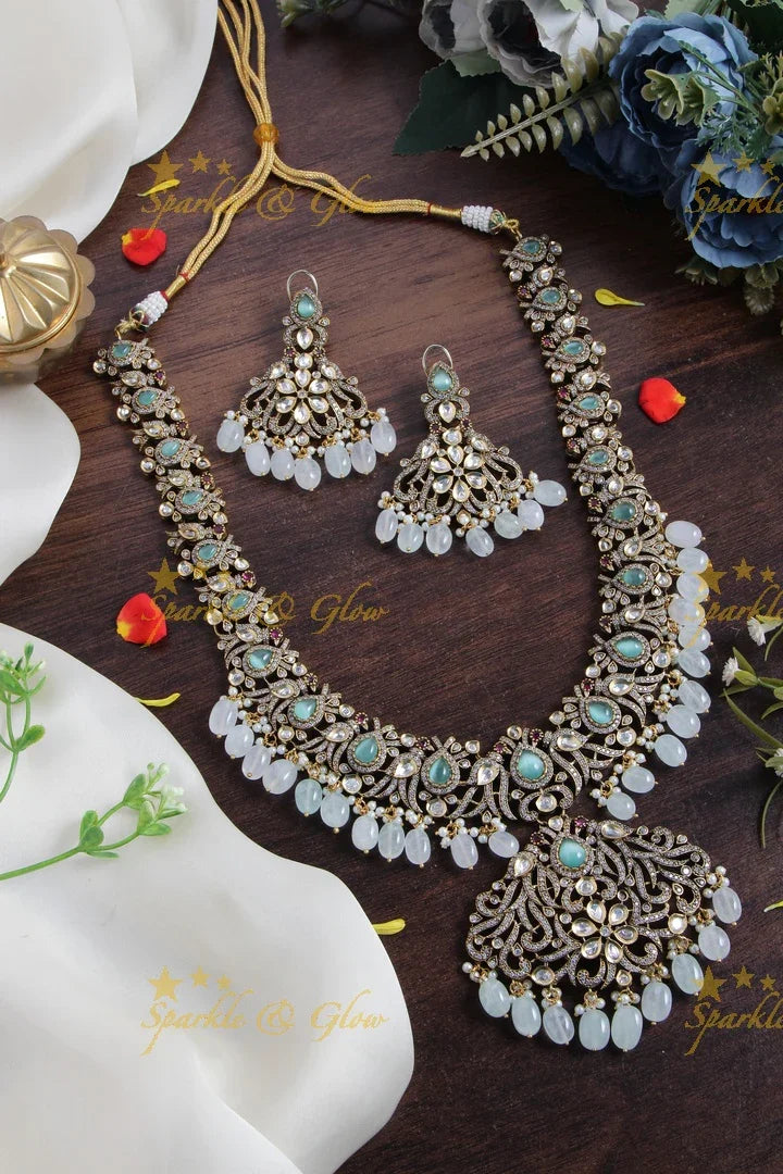 Gorgeous peacock and floral design Victorian AD long necklace with sea blue stones and beads - Sparkle and Glow