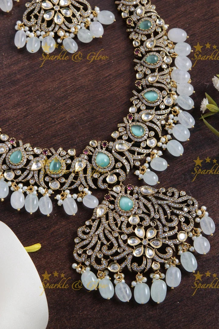 Gorgeous peacock and floral design Victorian AD long necklace with sea blue stones and beads - Sparkle and Glow