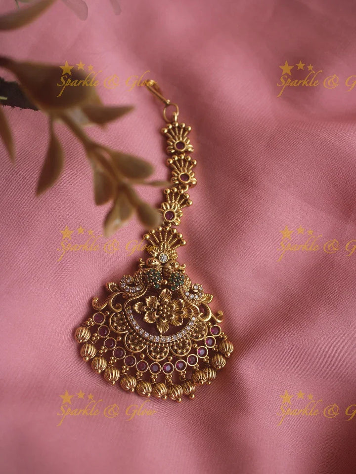 Peacock maang tikka with cz stones ruby emerald and gold beads - Sparkle and Glow