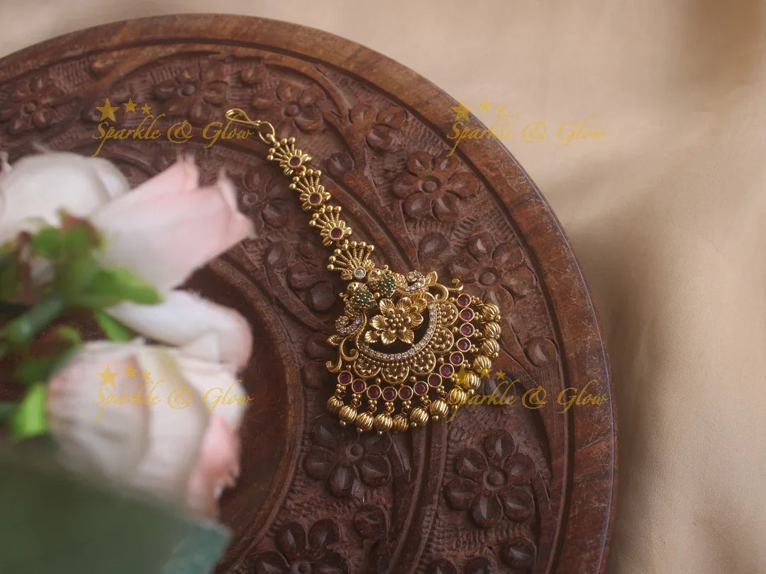 Peacock maang tikka with cz stones ruby emerald and gold beads - Sparkle and Glow