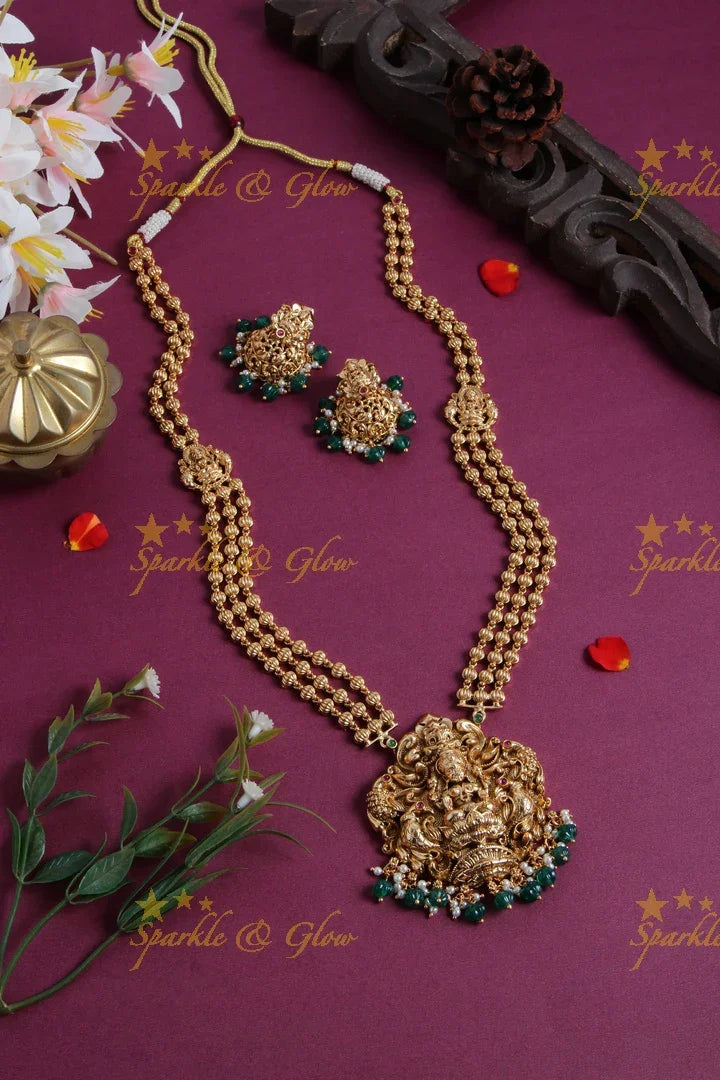 Gold Alike Lakshmi peacock carved pendent multi layer gold beads haram with green beads - Sparkle and Glow