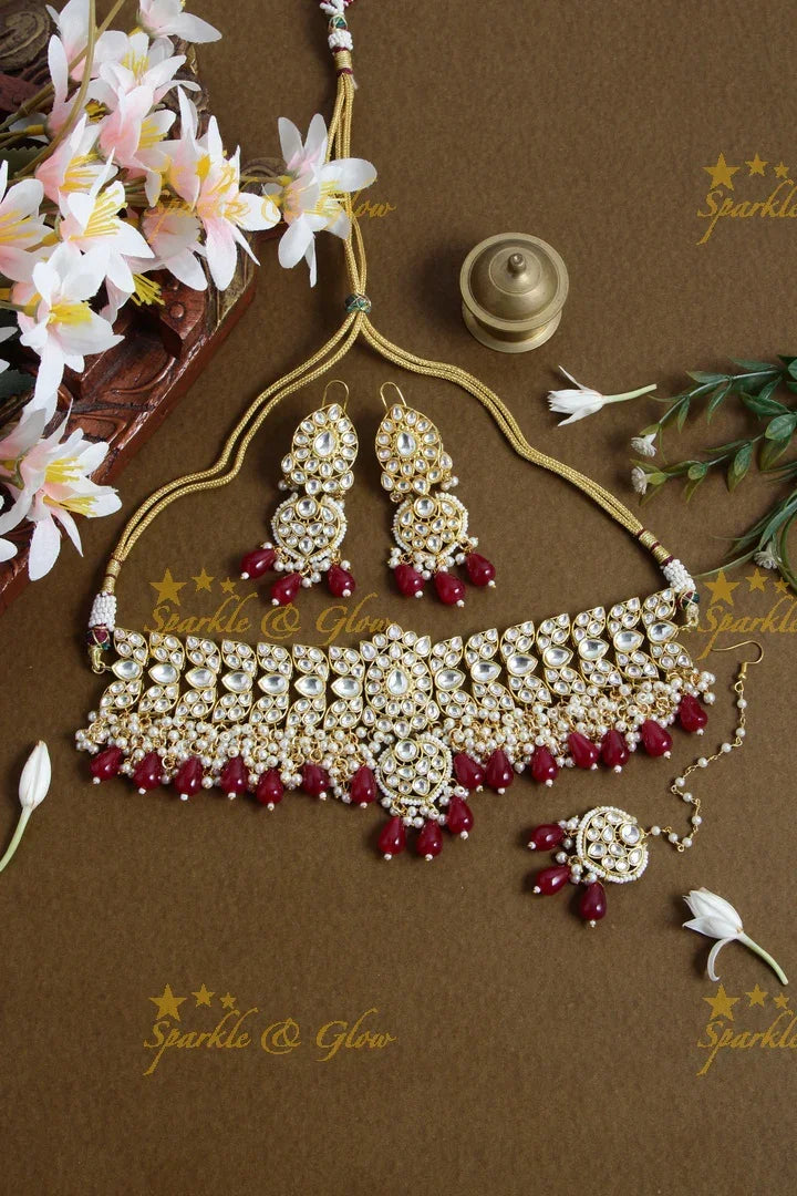 Grand floral design kundan choker with pearls and red beads - Sparkle and Glow