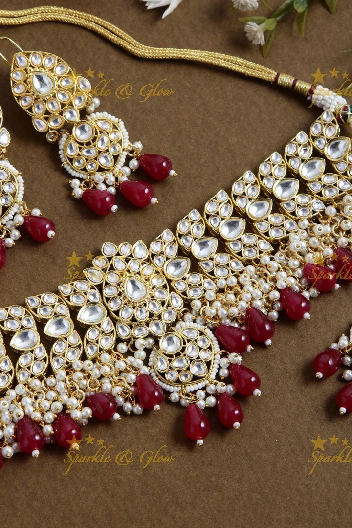 Grand floral design kundan choker with pearls and red beads - Sparkle and Glow