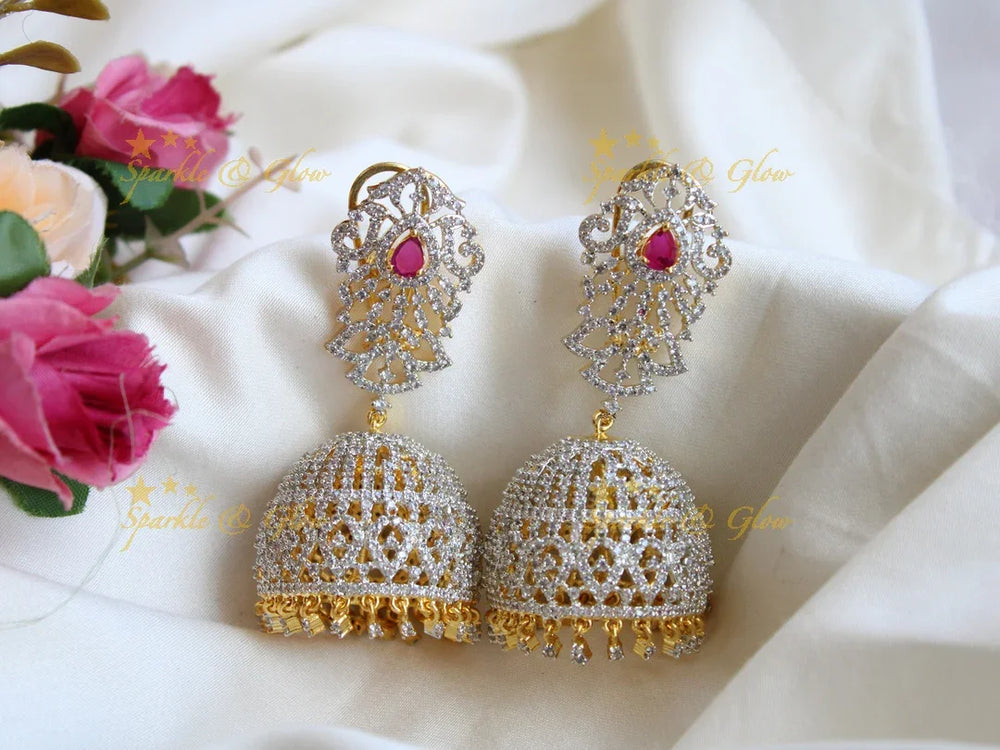 Grand intricate design American diamond jumukas with emerald - Sparkle and Glow