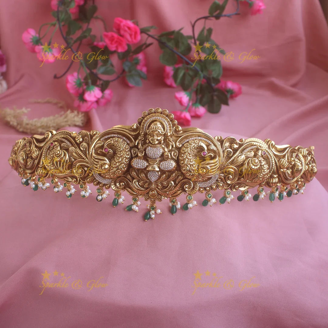Intricate gold alike Lakshmi hipbelt with green beads - Sparkle and Glow