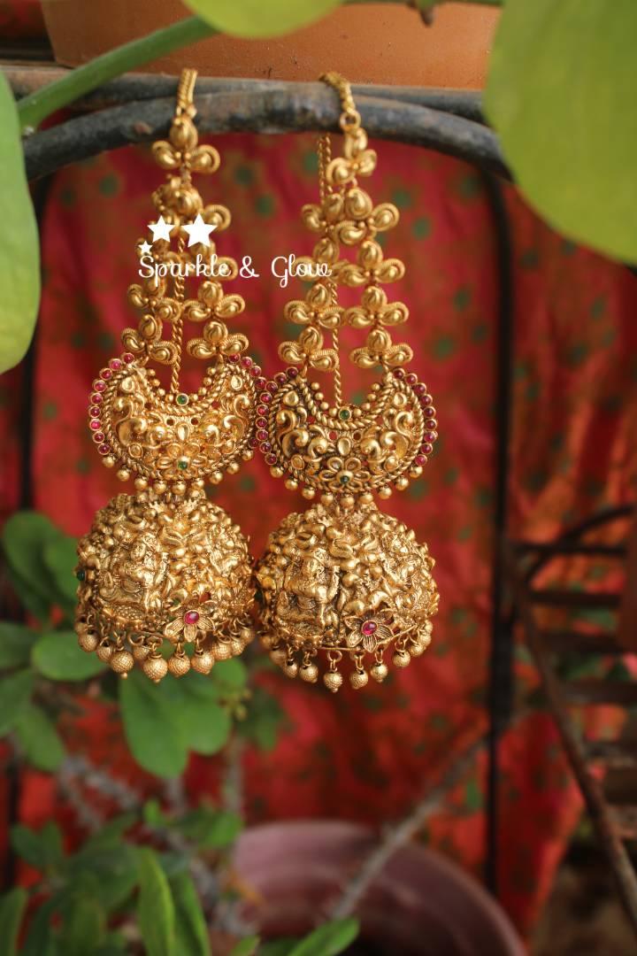 Gold alike polished intricate work lakshmi jhumuaks with ear chain - Sparkle and Glow