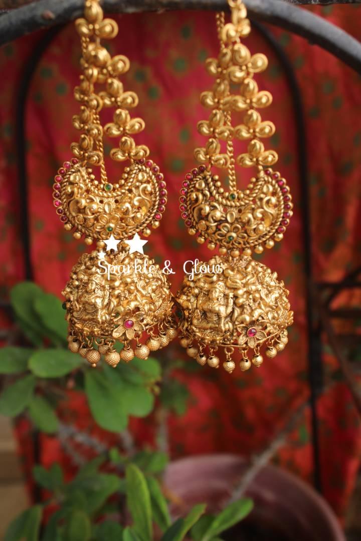 Gold alike polished intricate work lakshmi jhumuaks with ear chain - Sparkle and Glow