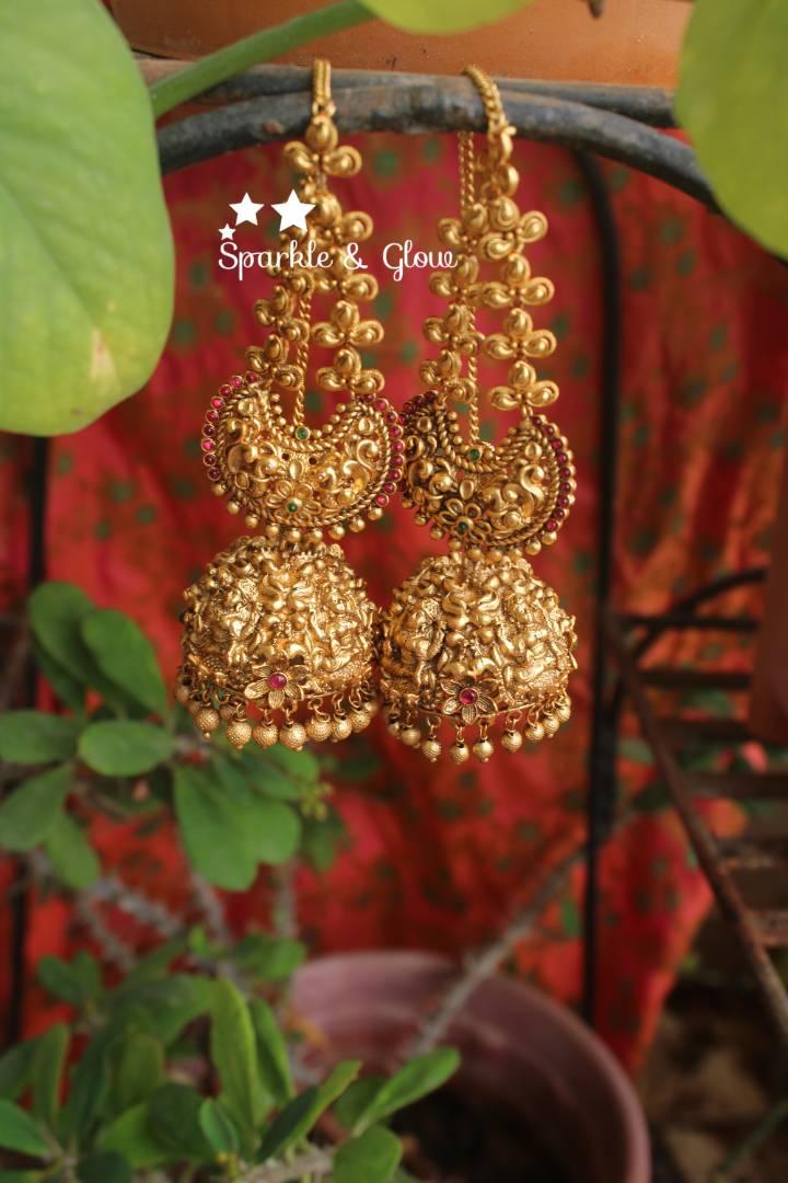 Gold alike polished intricate work lakshmi jhumuaks with ear chain - Sparkle and Glow
