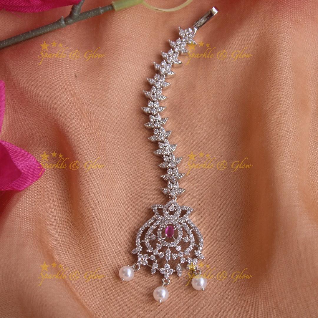 Exclusive silver polish floral and leaf maang tikka with pearls and ruby - Sparkle and Glow