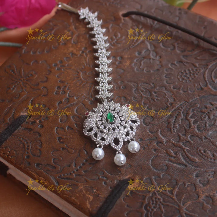 Statement silver polish peacock and floral maang tikka with pearls and ruby - Sparkle and Glow