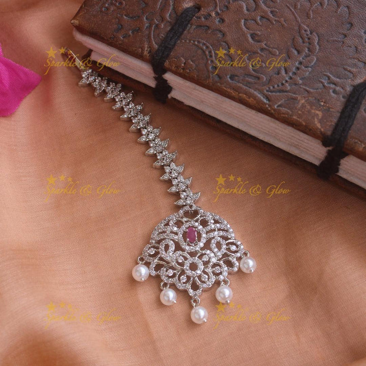 Sparkling silver polish floral maang tikka with pearls and ruby - Sparkle and Glow