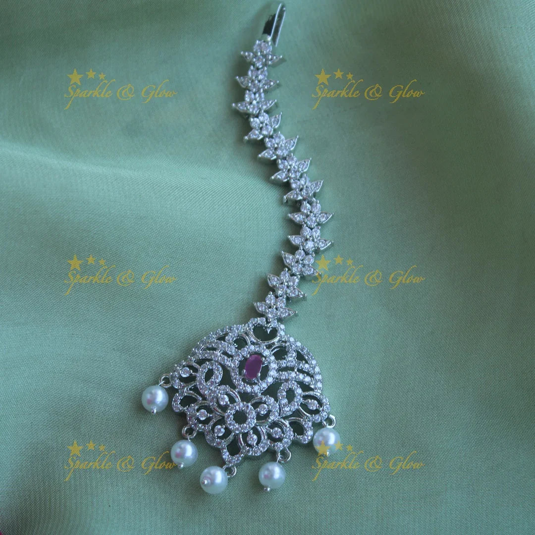 Sparkling silver polish floral maang tikka with pearls and ruby - Sparkle and Glow