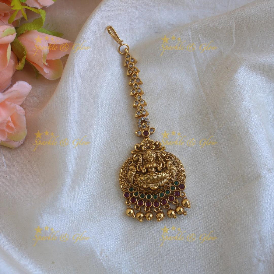 Beautiful Lakshmi peacock carved maang tikka with ruby emerald and gold beads - Sparkle and Glow