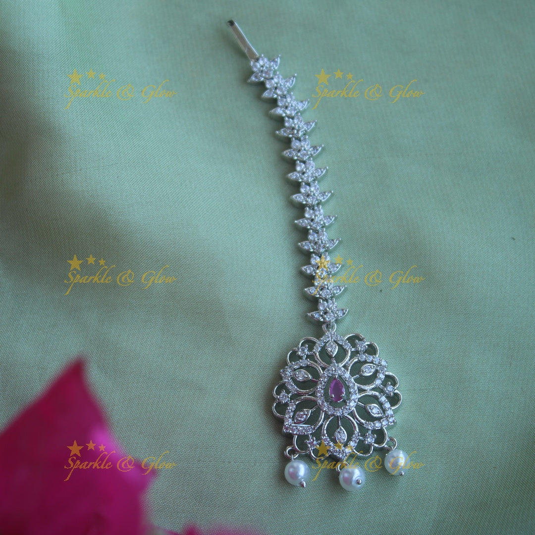 Elegant silver polish floral maang tikka with pearl and ruby