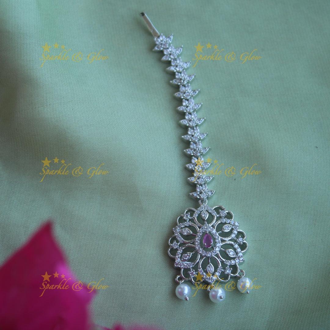 Elegant silver polish floral maang tikka with pearl and ruby - Sparkle and Glow