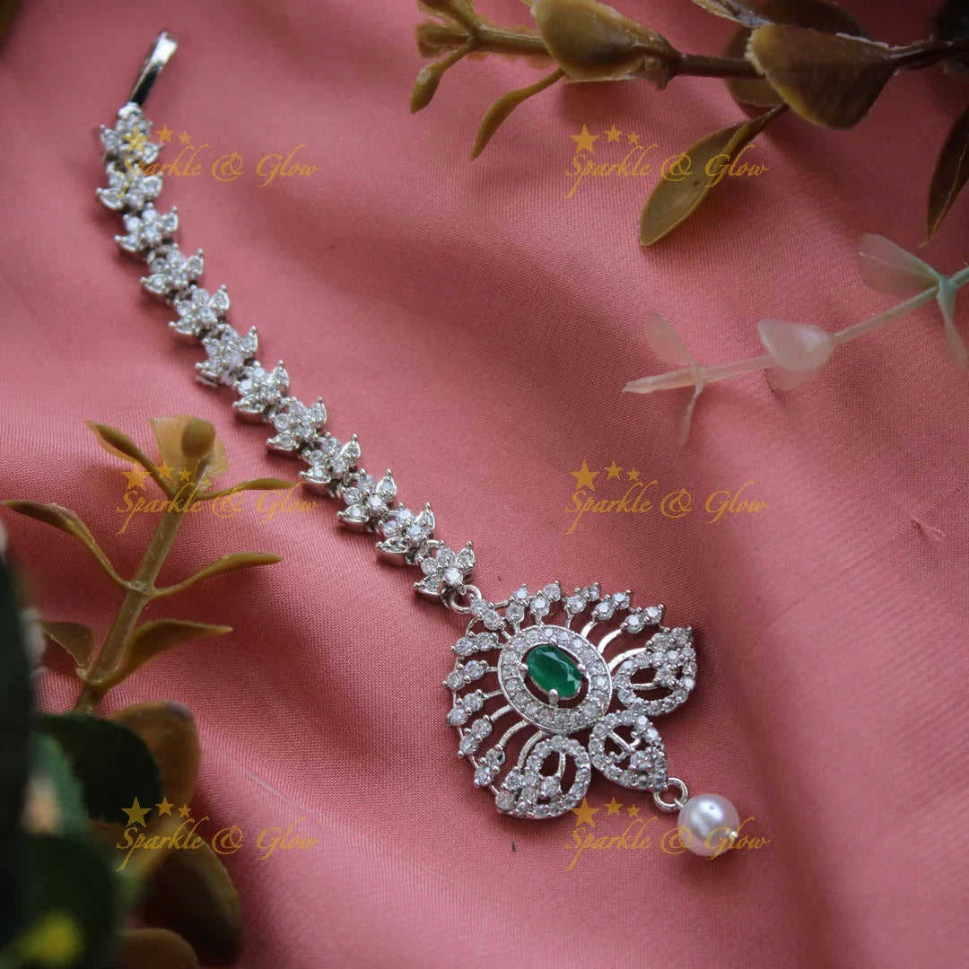 Exclusive silver polish peacock feather design maang tikka with pearl and emerald - Sparkle and Glow