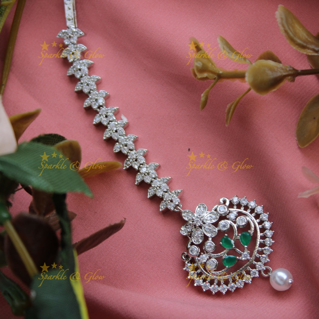 Elegant silver polish floral design maang tikka with pearl and emerald