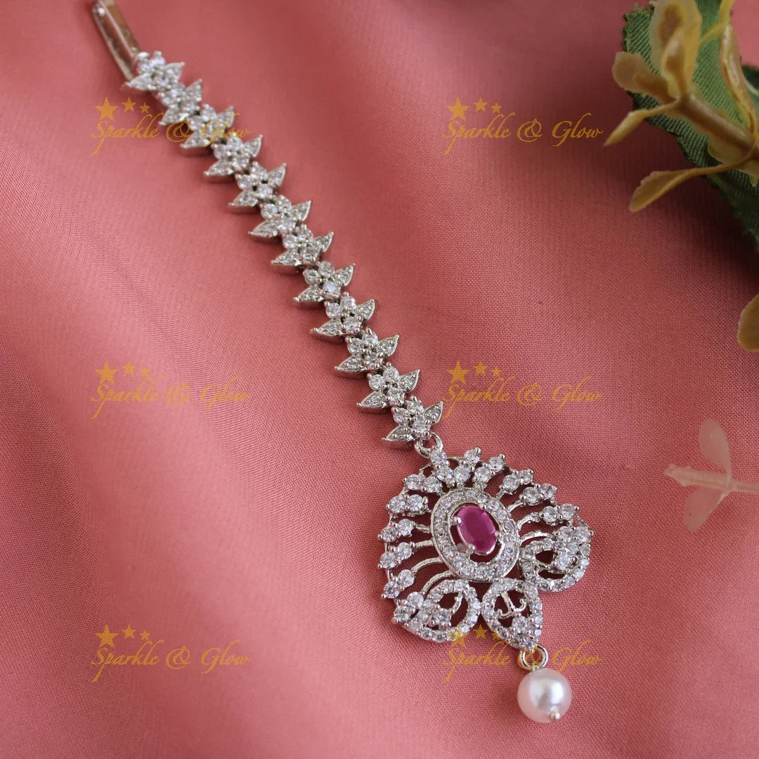 Exclusive silver polish peacock feather design maang tikka with pearl and emerald - Sparkle and Glow