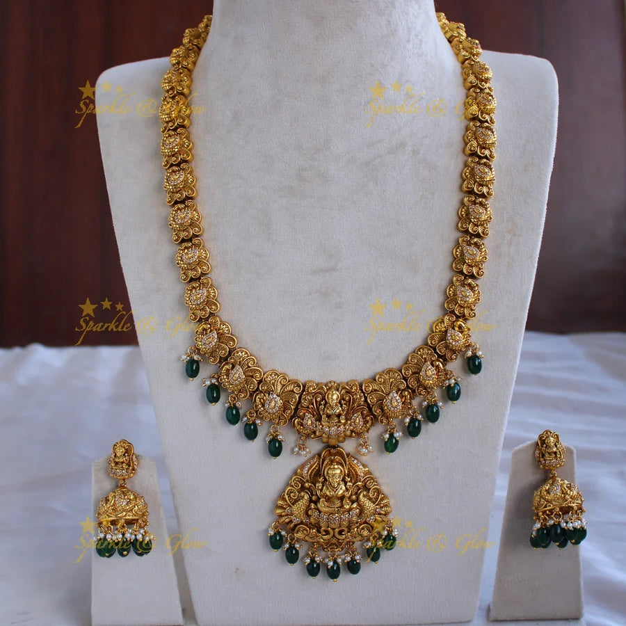 Grand gold alike Lakshmi peacock carved long necklace with CZ stones and green beads - Sparkle and Glow