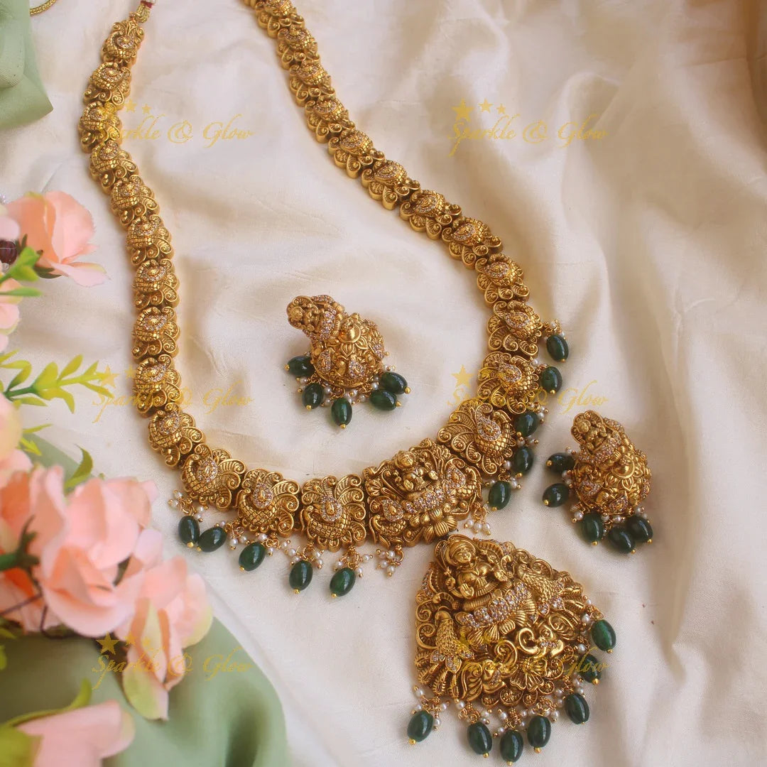 Grand gold alike Lakshmi peacock carved long necklace with CZ stones and green beads - Sparkle and Glow