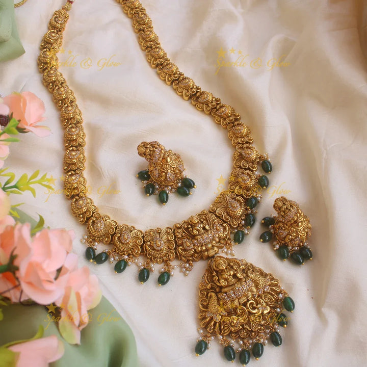 Grand gold alike Lakshmi peacock carved long necklace with CZ stones and green beads - Sparkle and Glow
