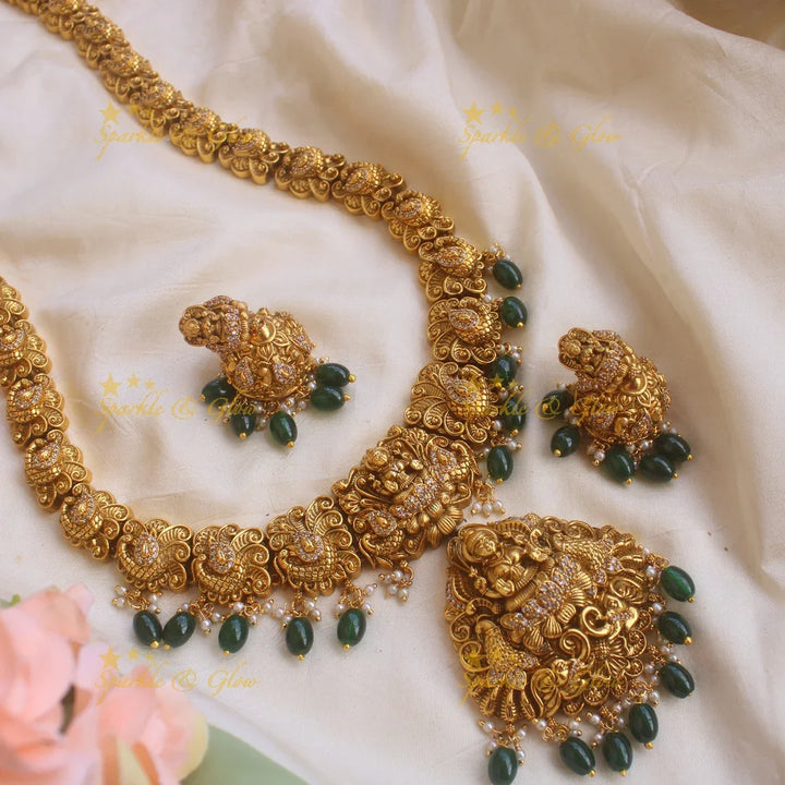 Grand gold alike Lakshmi peacock carved long necklace with CZ stones and green beads - Sparkle and Glow