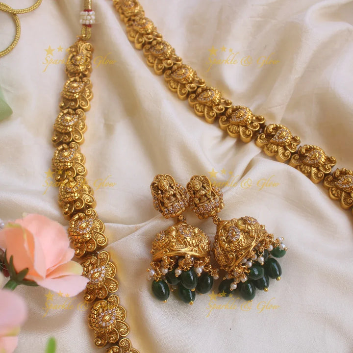 Grand gold alike Lakshmi peacock carved long necklace with CZ stones and green beads - Sparkle and Glow