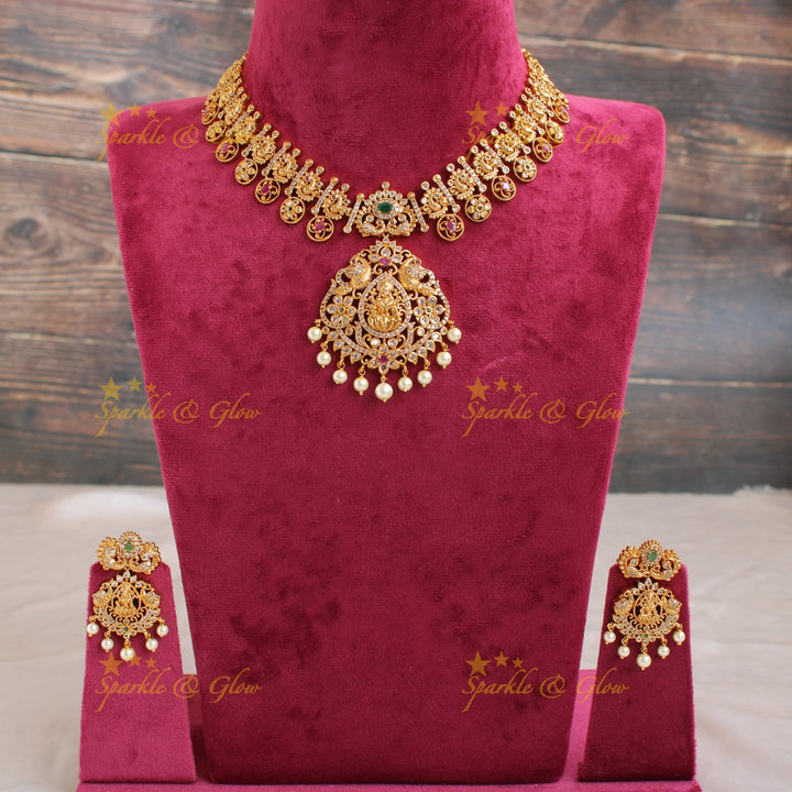 Elegant Lakshmi peacock and floral drops short necklace with CZ stones pearls ruby and emerald