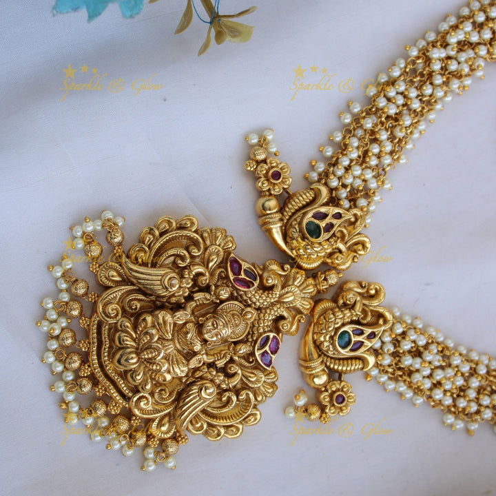 Grand intricate Lakshmi peacock carved long necklace with cluster pearls