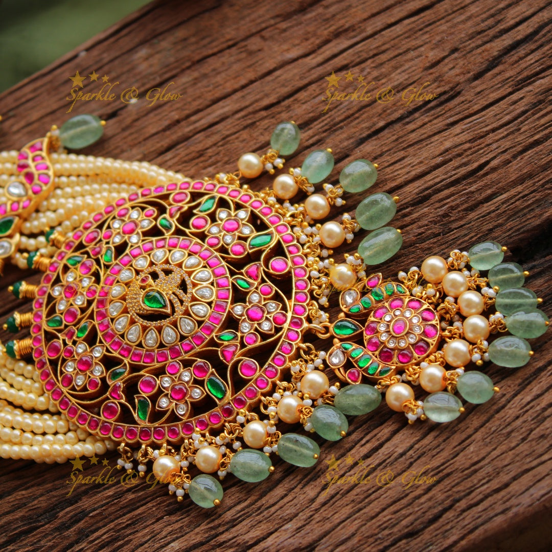 Exclusive Peacock floral design jadau Rani haram with multi layer pearl chain and green beads
