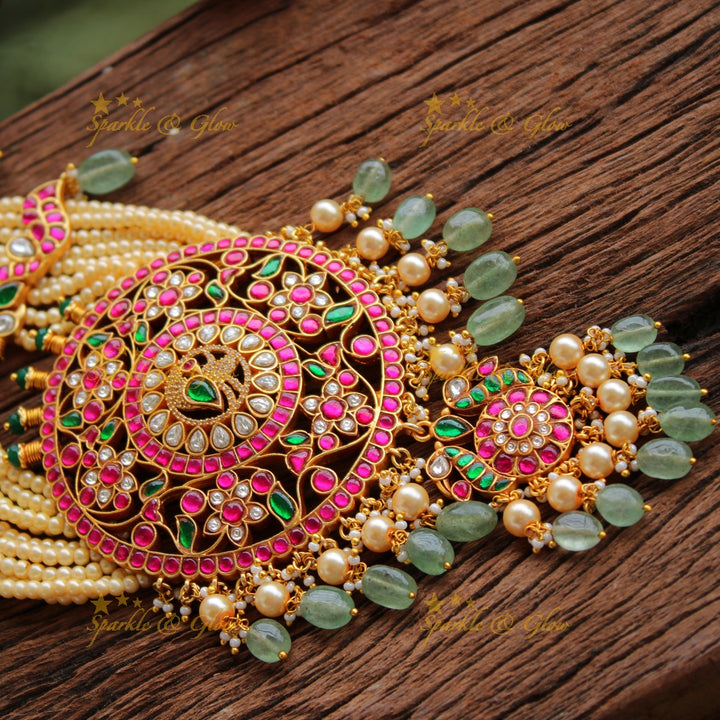 Exclusive Peacock floral design jadau Rani haram with multi layer pearl chain and green beads