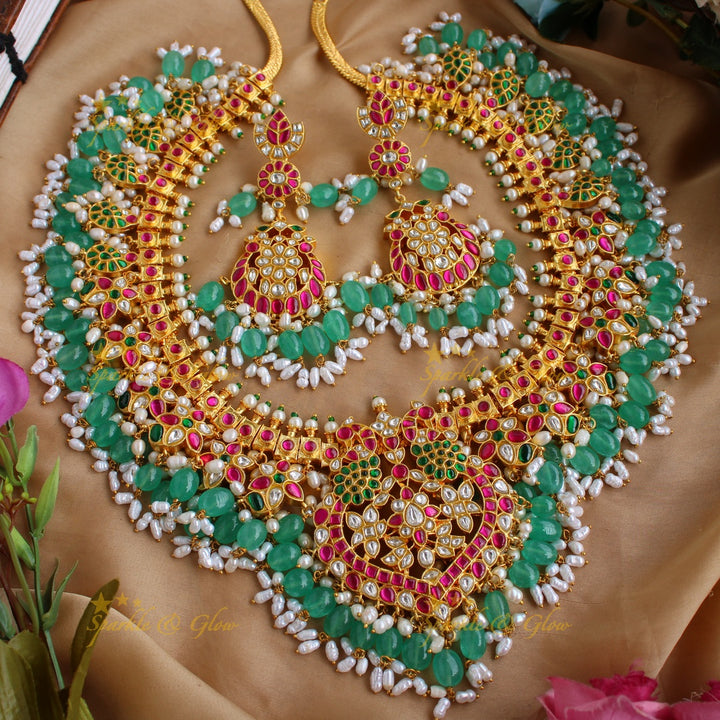 Gorgeous Peacock and floral design jadau long necklace with green beads and rice pearls