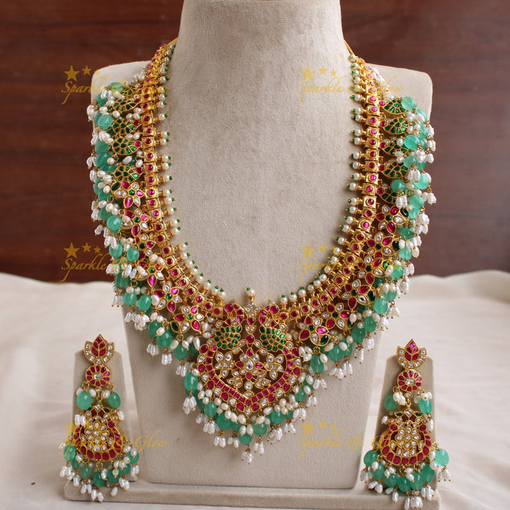 Gorgeous Peacock and floral design jadau long necklace with green beads and rice pearls