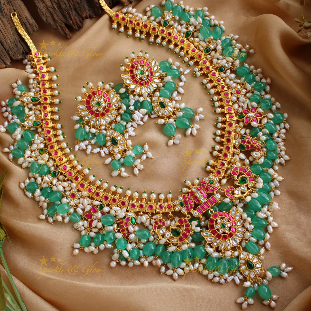 Exclusive grand Peacock and floral jadau long necklace with green beads and rice pearls